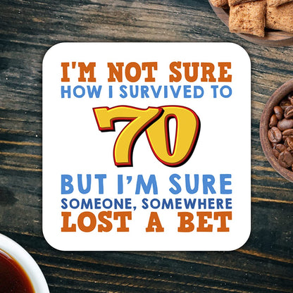CS566 I'm Not Sure How i Survived to 70 But I'm Sure Someone, Somewhere Lost a Bet. Novelty Funny Coffee Tea Drink Gift Glossy MDF Wooden Coaster