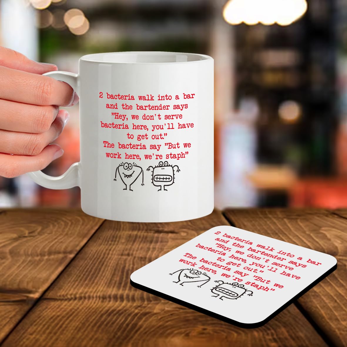 SM015 2 bacteria walk into a bar and the bartender says " hey, we don't serve bacteria here, you'll have to get out." The bacteria say "But we work here, we're Staph" - 11OZ Mug & Matching Coaster Set