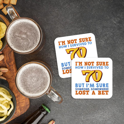 CS566 I'm Not Sure How i Survived to 70 But I'm Sure Someone, Somewhere Lost a Bet. Novelty Funny Coffee Tea Drink Gift Glossy MDF Wooden Coaster